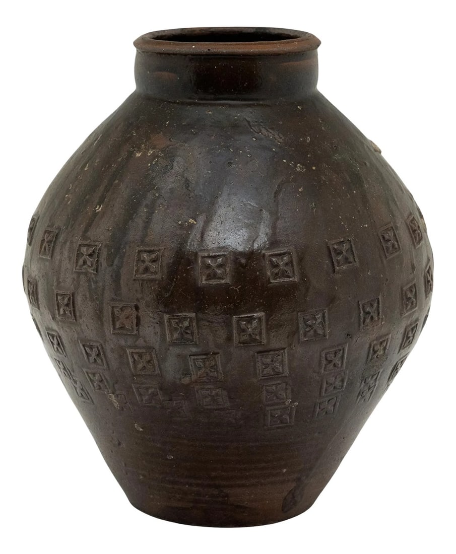 Stamped Chinese Yunnan Pot, c. 1800: This unique 19th century Chinese earthenware pot is distinguished by its remarkable stamp pattern. With a brown drip glaze, this vase features a bulbous shaped body that stands on a flat unglazed base