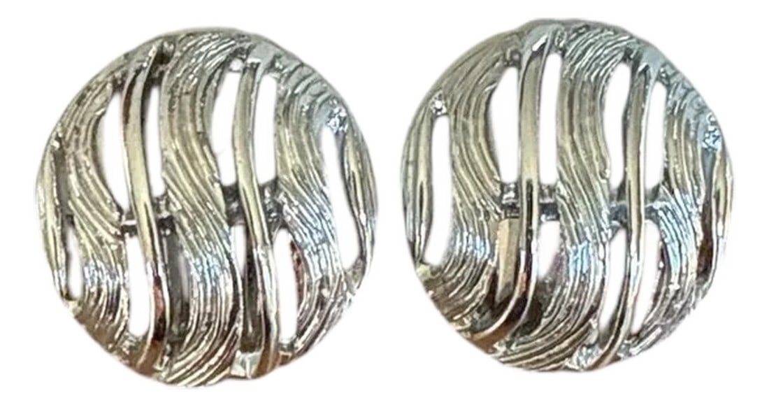 1980s Kramer Vintage Silver Tone Earrings, A Pair: Vintage Silvertone round button clip on earrings by Kramer. Bands of textured swirl and polish in modern late 20th century style. Marked Kramer on lever back and earring .75" round x .25" deep