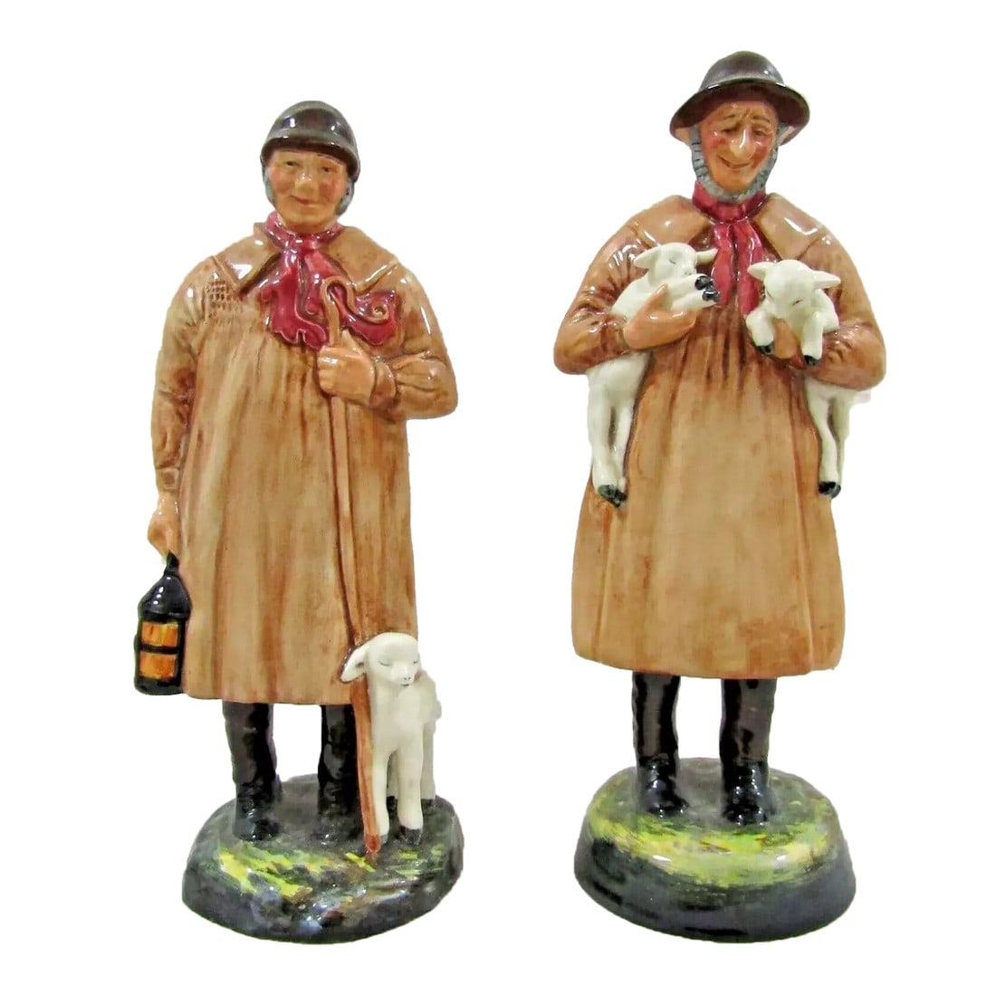 Pair Royal Doulton Figurines Lambing Time and Shepherd 1940s: Royal Doulton Pair Figurines Lambing Time and Shepherd 1940s The Shephard measures 4" wide, 3 1/4" deep and 8 3/4" tall. Lambing Time measures 3 3/4" wide, 3" deep and 9 1/4" tall. Condition: Alterati