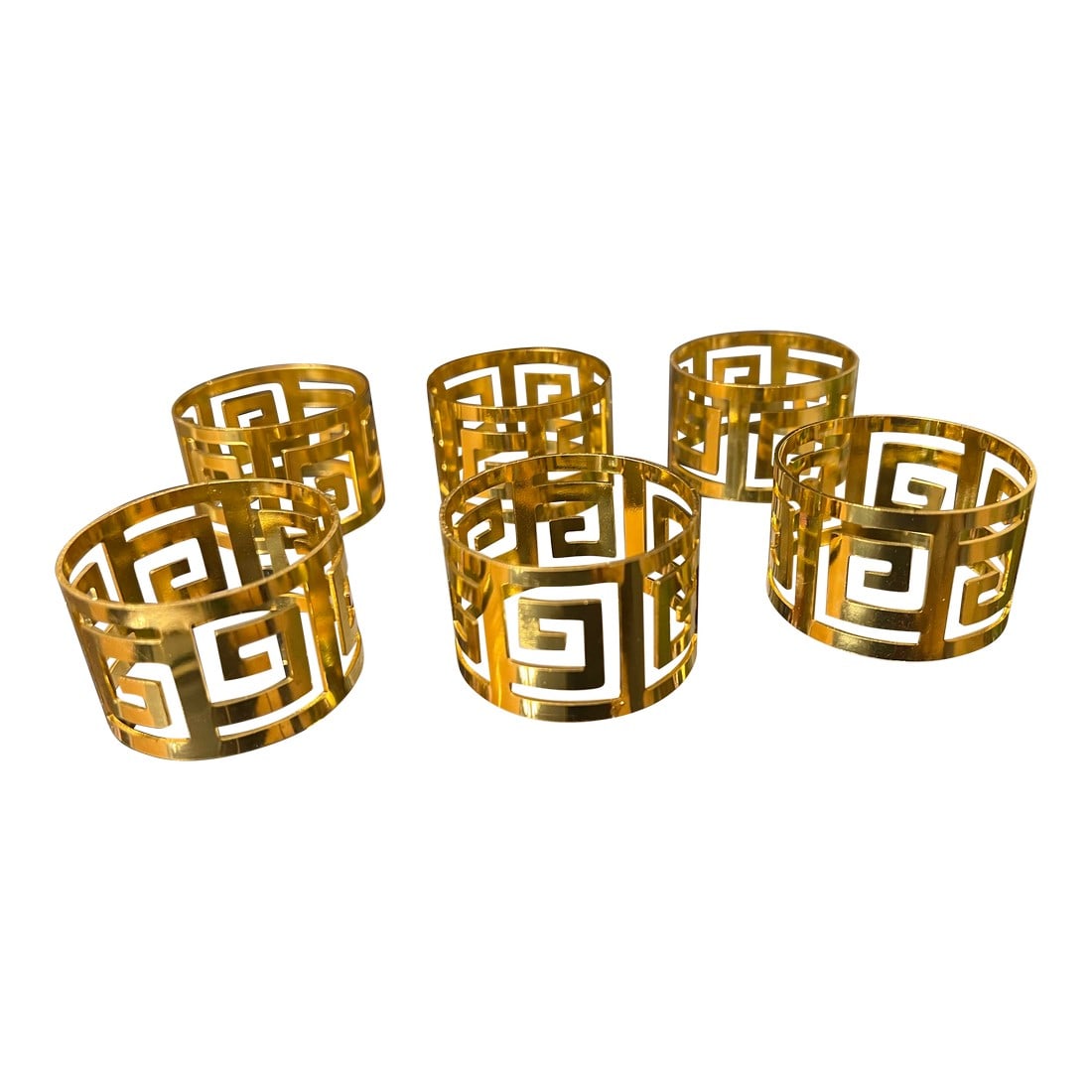 Collection of Greek Key Gold Napkin Rings- Set of 61970s: Up for consideration is a beautiful collection of gold Greek key napkin rings. These would look lovely in your home and they are a great find for the interior design enthusiast. Please check out my