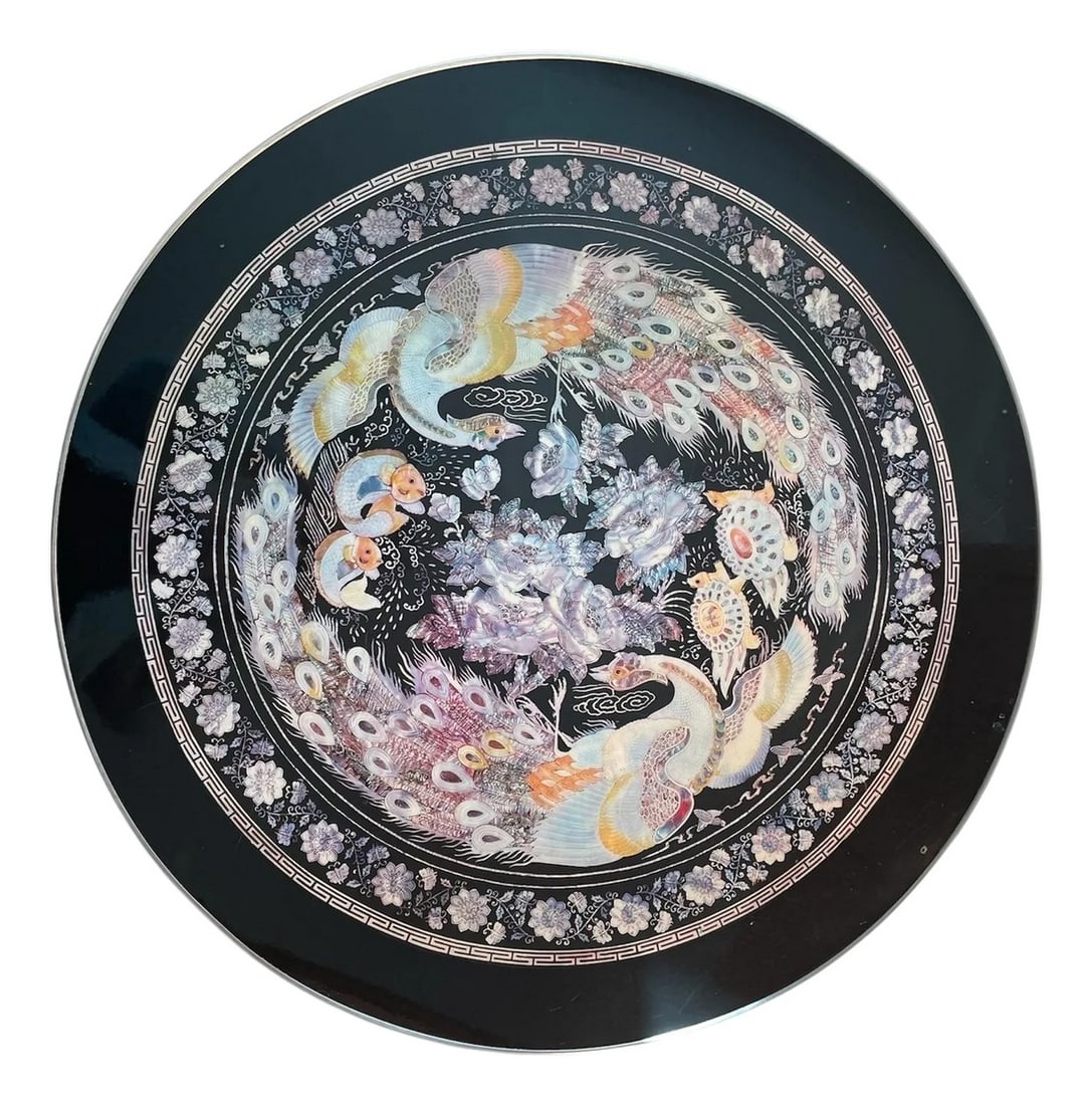 1960s Asian Style Coffee Table: Geogeous round coffee table with bird motif and lacquered finish. The legs are adjustable. Condition: Alterations: Original Condition Unaltered Imperfections: Some Imperfections Condition Notes: