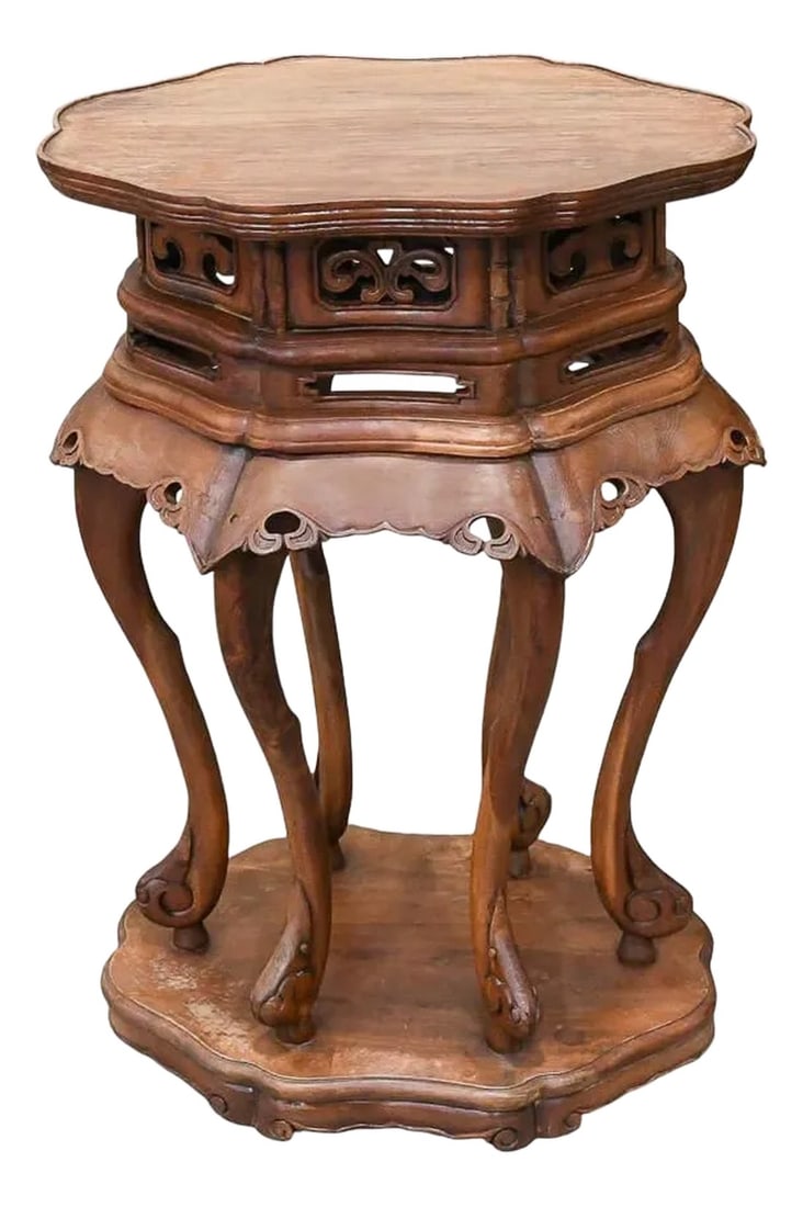 Carved Chinese Ming Style Hardwood Side Table Stand: This beautifully carved Chinese Ming-style hardwood side table showcases the elegance and craftsmanship of traditional Chinese design. With its intricate latticework, scalloped apron, and gracefully c
