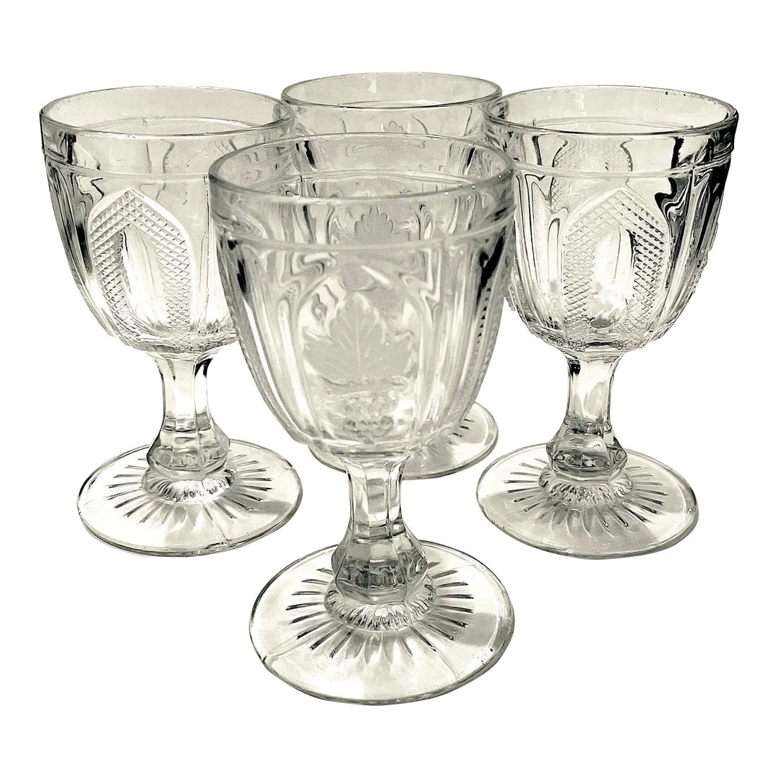 1870's E. A. P. G.. Flint Glass "Grape and Magnet" Water Goblets - Set of 4: Starting in 1826 the Boston & Sandwich Glass Company manufactured affordable glassware by "pressing" molten glass into decorative molds. Providing attractive yet affordable glassware to the masses