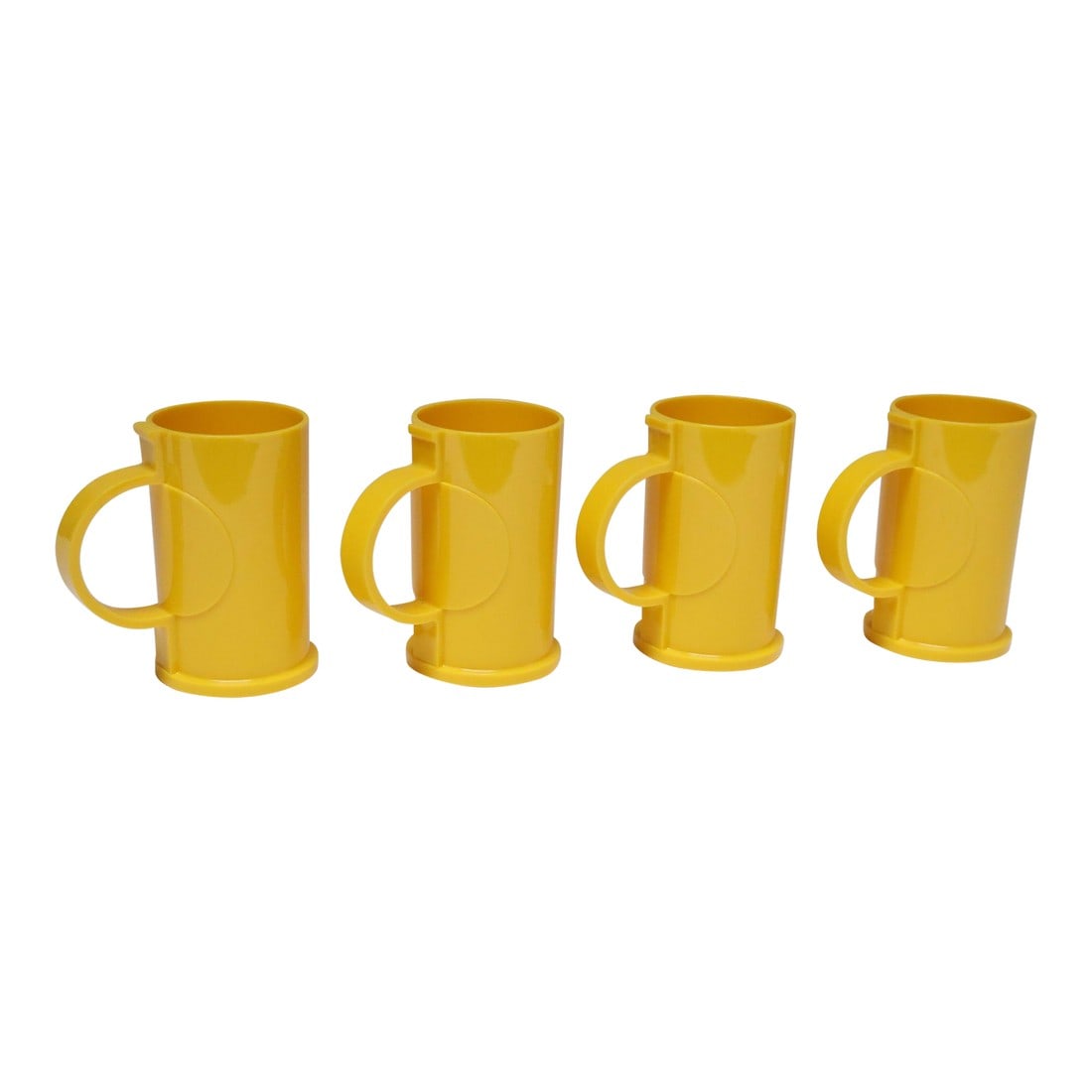 Set of Four Mid Century Modern Yellow Plastic Mugs / Tumblers by Gunnar Cyren for Dansk: Set of four vintage hard plastic tall cups / tumblers with handles designed by the Swedish Artist (and former Orrefors designer) Gunnar Cyrén for Dansk International Designs, New York (ca.