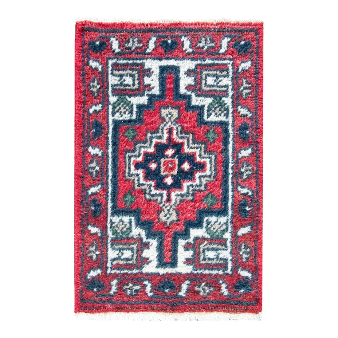 Vintage Persian Hamandan Rug: A charming petite late 20th century Persian Hamadan rug with a central geometric patterned medallion surrounded by a simple leaf and scrolling vine patterned border, and all woven in crimson, indigo,