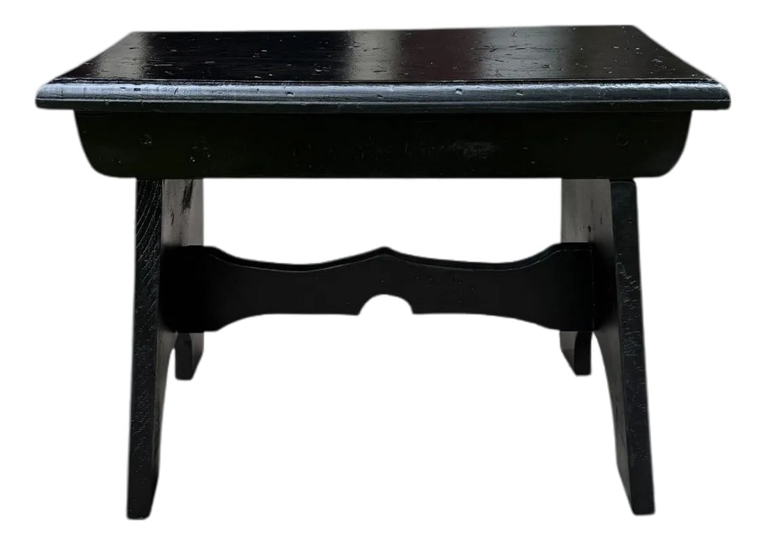 Vintage Farmhouse Wooden Step Stool: A sturdy aged and worn hand-made wood step stool - a low seat with lots of charm and character consistent with age and use- dings, and saw marks. It features a rectangular top with a rounded edge.