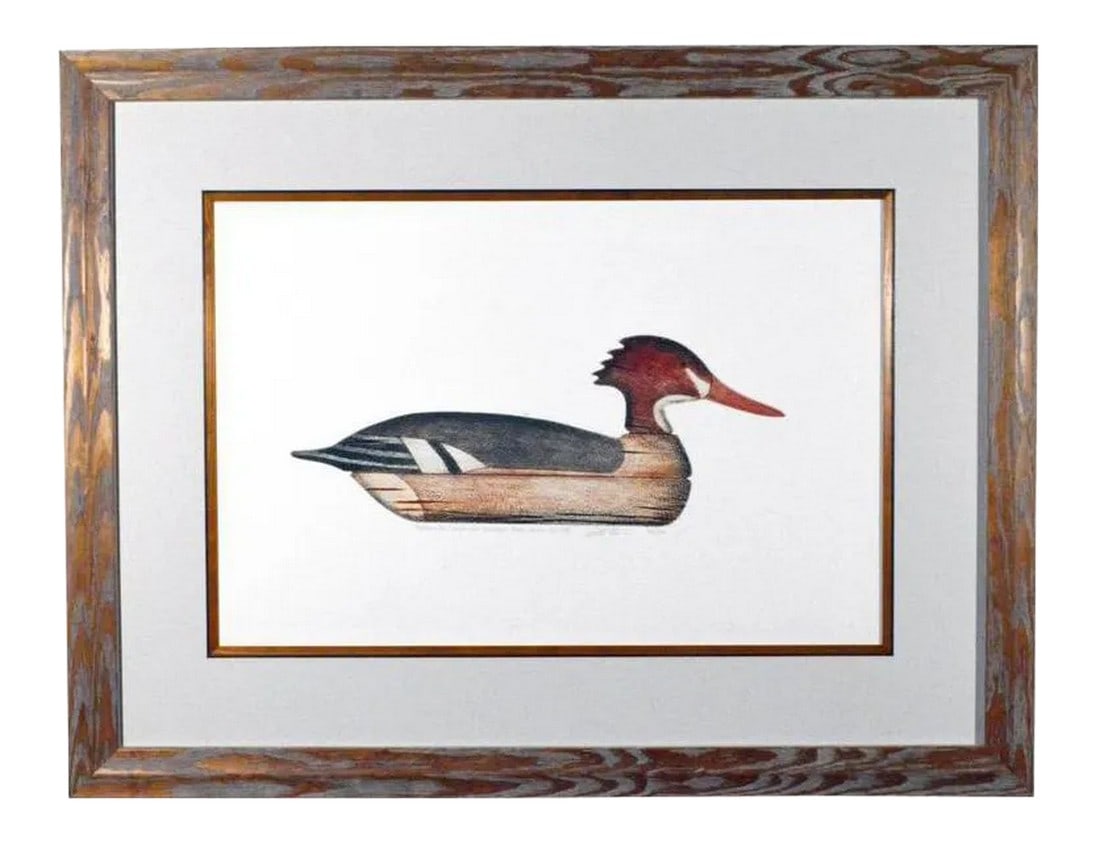 Arthur Nevin Red-Breasted Merganser Duck Decoy Print: American Folk Art Reimagined: A Print of a Duck Decoy by Arthur Nevin This lithograph print of a Redbreasted Merganser decoy is a compelling piece that bridges the worlds of American folk art, natural