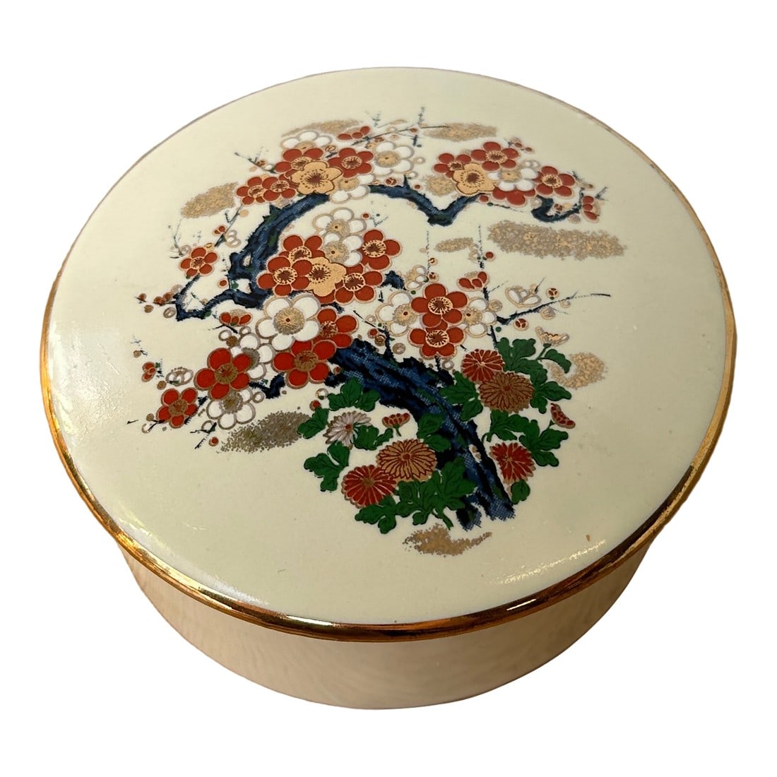 1970s Small White Asian Ceramic Box With Cherry Blossom Details: Up for consideration is a beautiful vintage Asian white ceramic box with cherry blossom accents. This would look lovely on display in your home, and it is a great conversation starter. This is also a