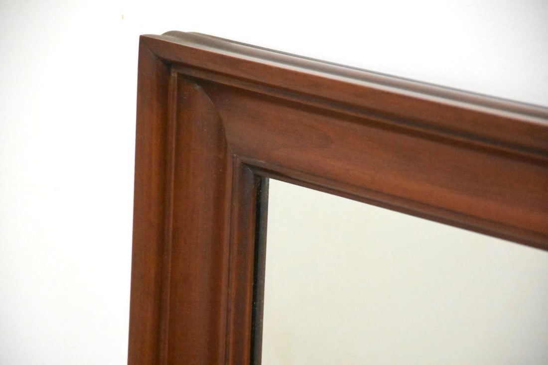 1990s Henkel Harris Cherry Wood Mirror: A solid cherry traditional mirror made by Henkel Harris. Condition: Alterations: Original Condition Unaltered Imperfections: Some Imperfections Condition Notes: Excellent condition Dimensions: Height: