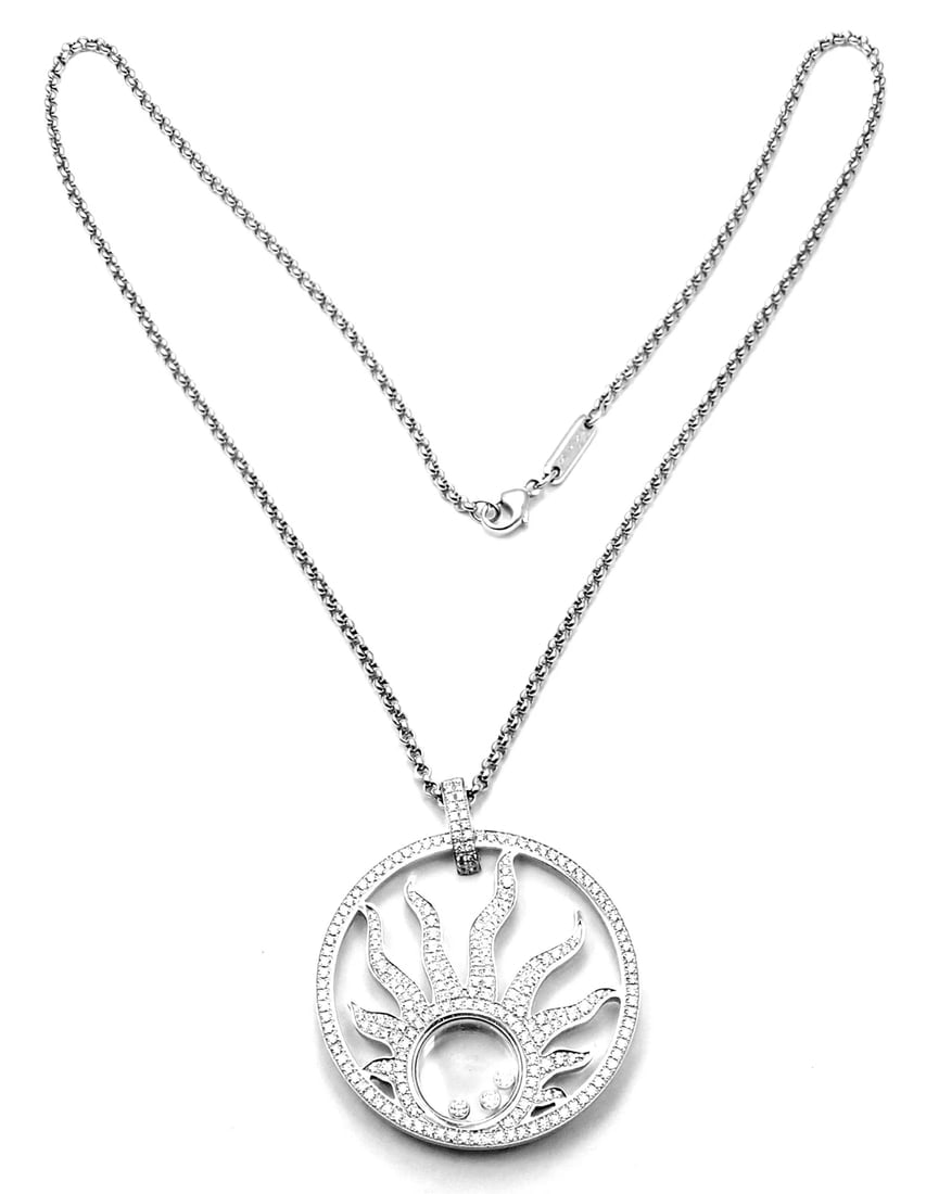 Authentic! Chopard Happy Diamond Sun 18K White Gold Pendant Necklace: Authentic! Chopard Happy Diamond Sun 18K White Gold Pendant Necklace About This Piece: Retail Price: $22,300 plus tax. Metal: 18k White Gold Measurements: Length: 16.5" Width: 2mm Pendant: 40mm x 34mm