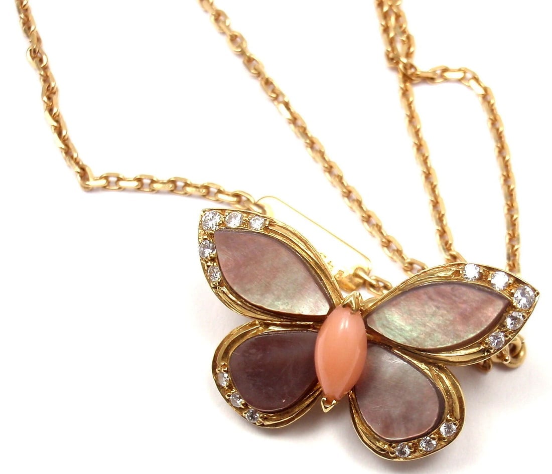 VAN CLEEF & ARPELS 18k Yellow Gold Diamond MOP Coral Butterfly Brooch Necklace: VAN CLEEF & ARPELS 18k Yellow Gold Diamond MOP Coral Butterfly Brooch Necklace About This Piece: Metal: 18k Yellow Gold Measurements: 17'' necklace, 2mm, pendant is 23mm x 15mm Weight: 7.8 grams Stone