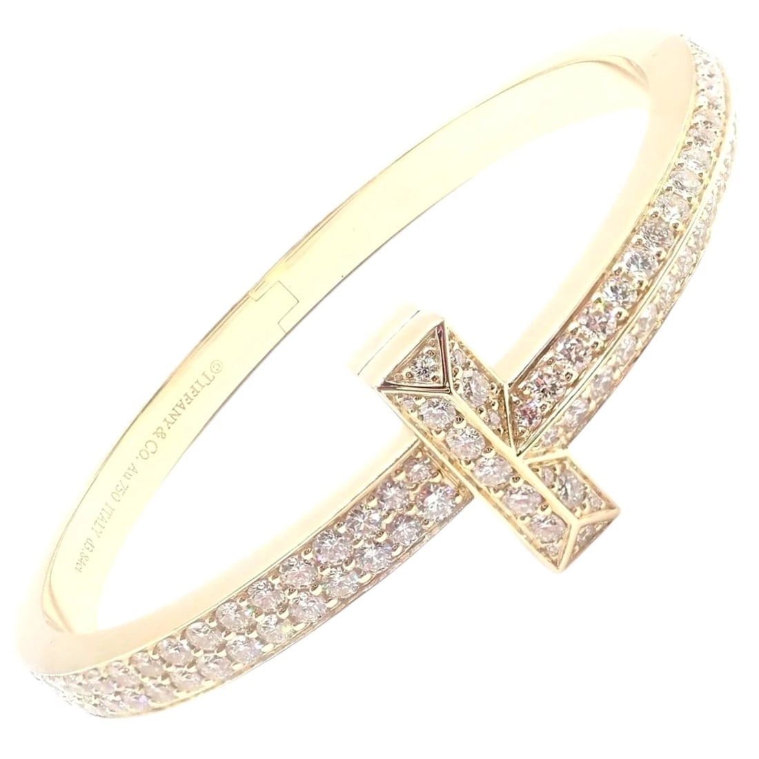 Authentic! Tiffany & Co 18k Yellow Gold Diamond T1 Wide Hinged Bangle Bracelet: Authentic! Tiffany & Co 18k Yellow Gold Diamond T1 Wide Hinged Bangle Bracelet About This Piece: This Tiffany & Co T1 wide hinged bangle is exquisitely fashioned in 18k yellow gold, showcasing a brill