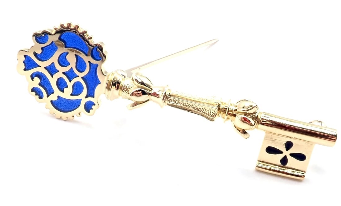 Rare! Authentic Vintage Mikimoto 18k Yellow Gold Key Blue Enamel Brooch Pin: Rare! Authentic Vintage Mikimoto 18k Yellow Gold Key Blue Enamel Brooch Pin About This Piece: Includes: Presentation Box Metal: 18k Yellow Gold Stones: Blue enamel Weight: 8.9 grams Measurements: 52mm