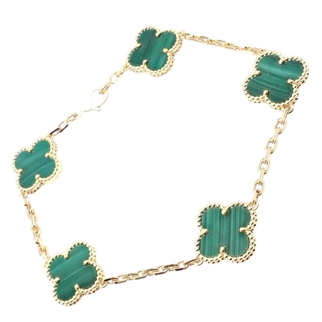 Authentic! Van Cleef & Arpels 18k Gold 5 Motif Malachite Alhambra Bracelet Cert.: Van Cleef & Arpels 18k gold Alhambra bracelet featuring five vivid malachite motifs framed in delicate beaded settings. Rich green Malachite enhance each clover’s natural beauty, symbolizing luc
