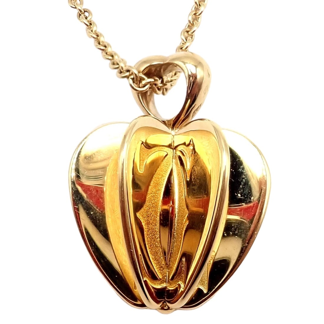 Rare! Cartier 18k Yellow Gold Double C 3D Apple Pendant Chain Necklace: Rare! Cartier 18k Yellow Gold Double C 3D Apple Pendant Chain Necklace About This Piece: The Rare Cartier 18k Yellow Gold Double C 3D Apple Pendant Chain Necklace is a luxurious and unique piece. Feat