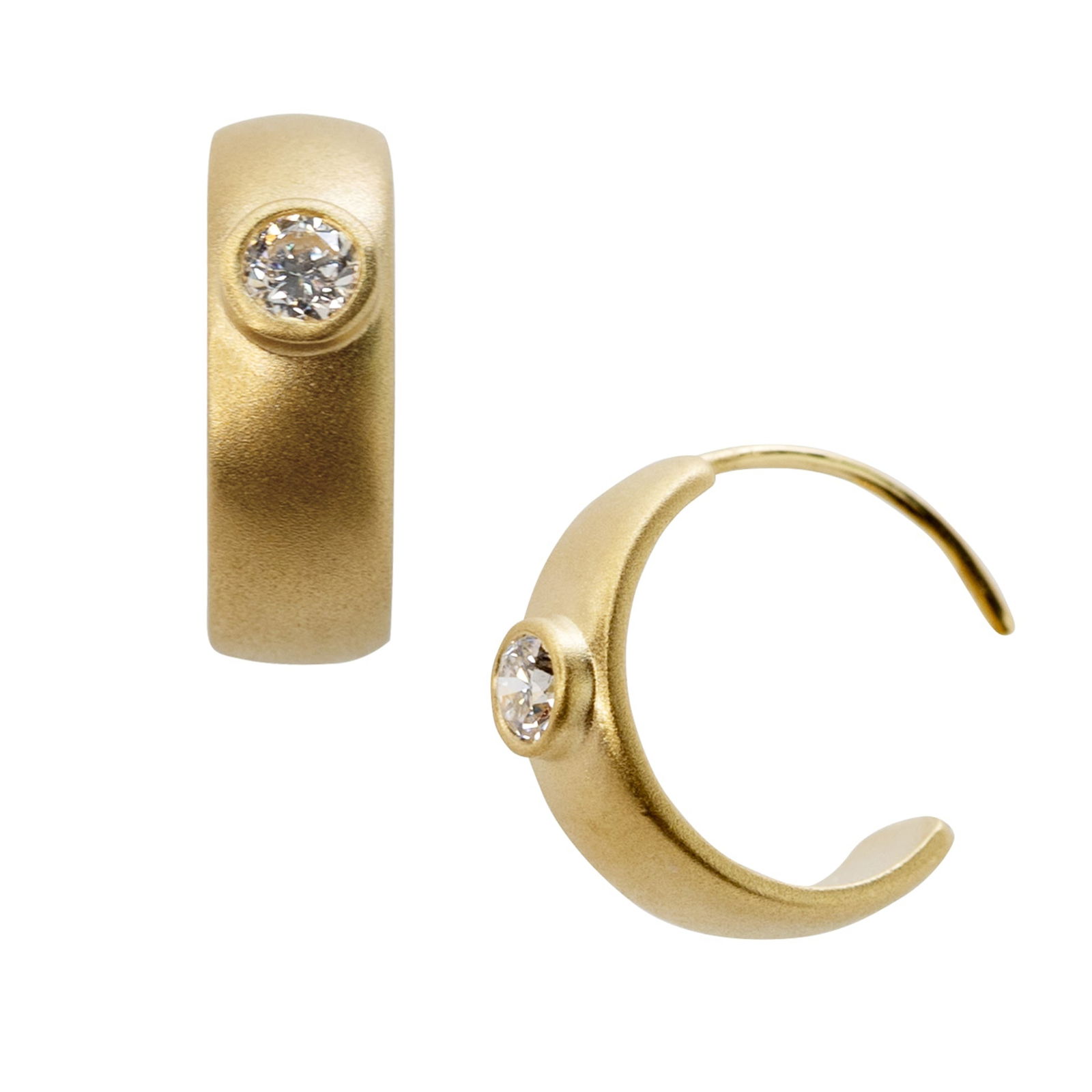 Meme Diamond Huggie 18 K Gold Earrings, 1/2" Round: Title:Meme Diamond Huggie 18 K Gold Earrings, 1/2" RoundDescription:A whisper of gold with a single point of light the Meme Diamond Huggie distills modern elegance into its purest form. Quiet,