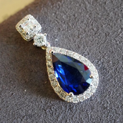 14K GOLD 1.25 CT NATURAL SAPPHIRE & DIAMOND PENDANT: Title:14K GOLD 1.25 CT NATURAL SAPPHIRE & DIAMOND PENDANTDescription:Ref:230528331Gold Content:14K GoldMain Gemstone:SapphireNumber of stones:1Shape:PearCarat Weight:1.25ct Color:Royal