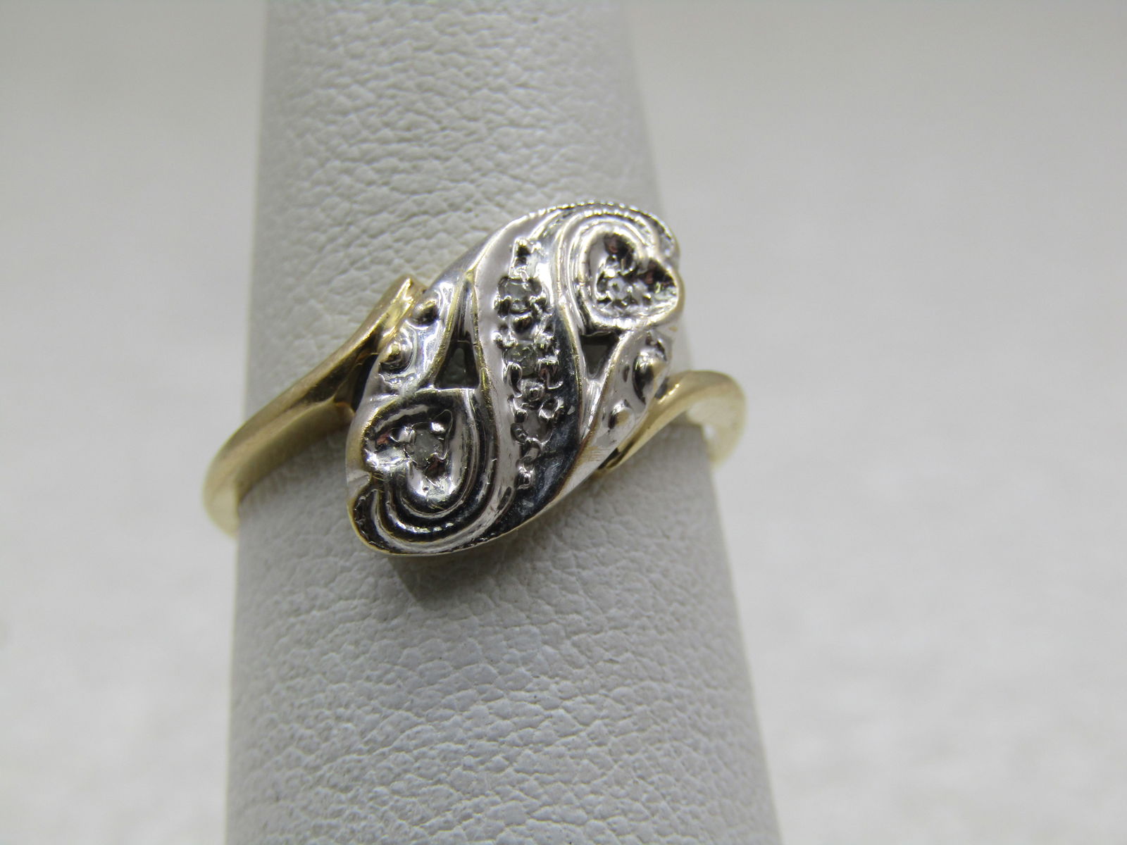 Vintage 14kt Scrolled Diamond Ring, Bypass, Signed KDC, Sz. 6: Title:Vintage 14kt Scrolled Diamond Ring, Bypass, Signed KDC, Sz. 6Description:Vintage 14kt Scrolled Diamond Ring, Bypass, Signed KDC, Sz. 6.5. . Thas has 14kt white and yellow gold - the top of the