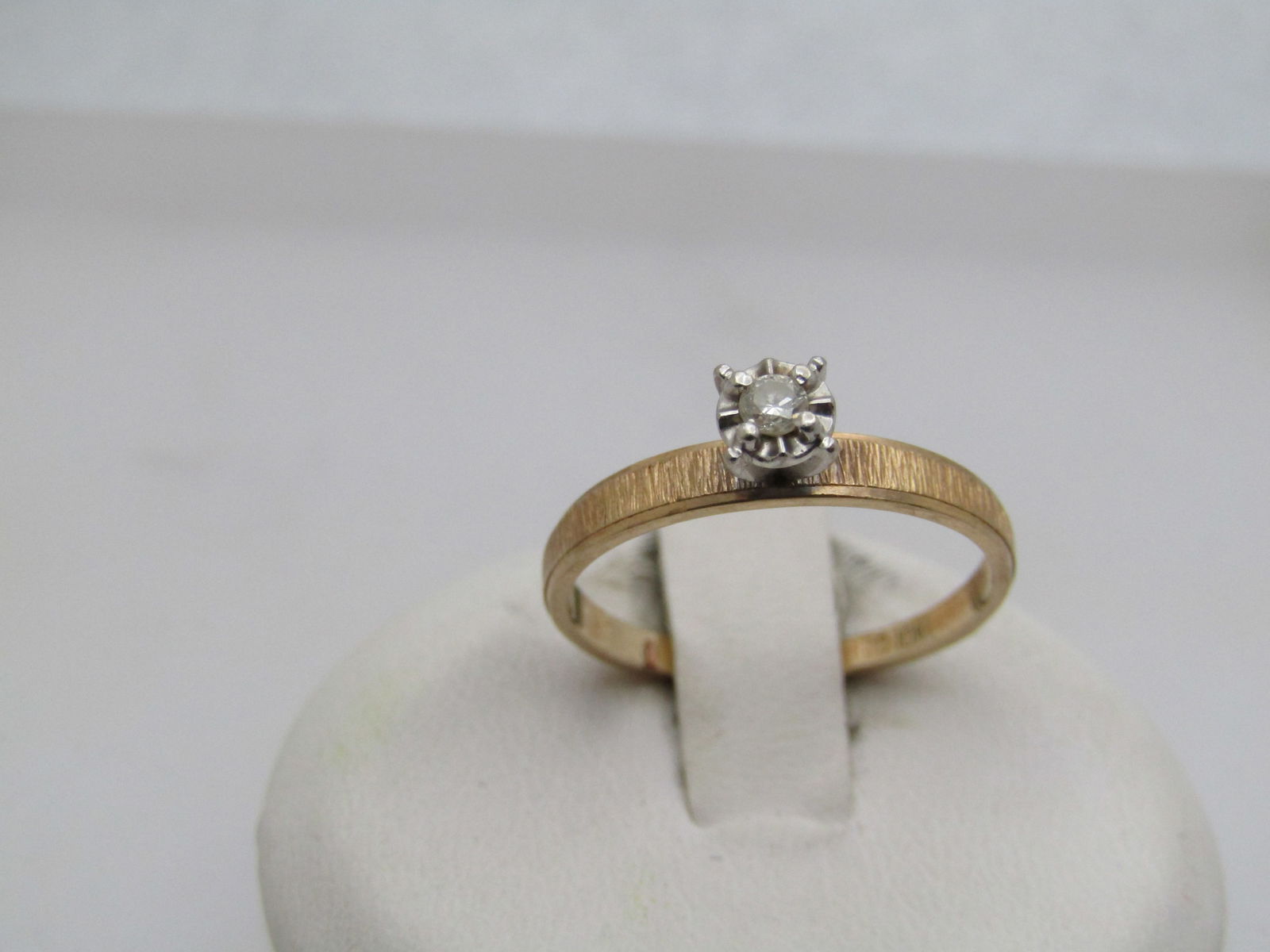 Vintage 10kt Diamond Engagement Ring, Signed DC , SZ. 6: Title:Vintage 10kt Diamond Engagement Ring, Signed DC , SZ. 6Description:Vintage 10kt Diamond Engagement Ring, Signed DC , SZ. 6. Yellow gold band with white gold setting. Illusion setting that is