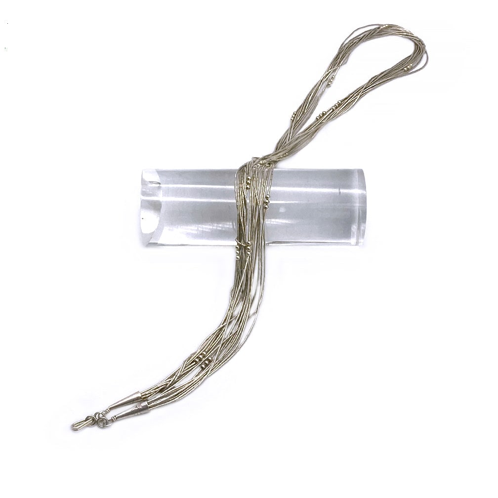 Southwestern Liquid Sterling Necklace: This is a ten strand Southwestern liquid sterling necklace with a hook clasp. Dimensions: 23.5 inch Reserve: $100.00 Shipping:Domestic: Flat-rate of $14.00 to anywhere within the contiguous