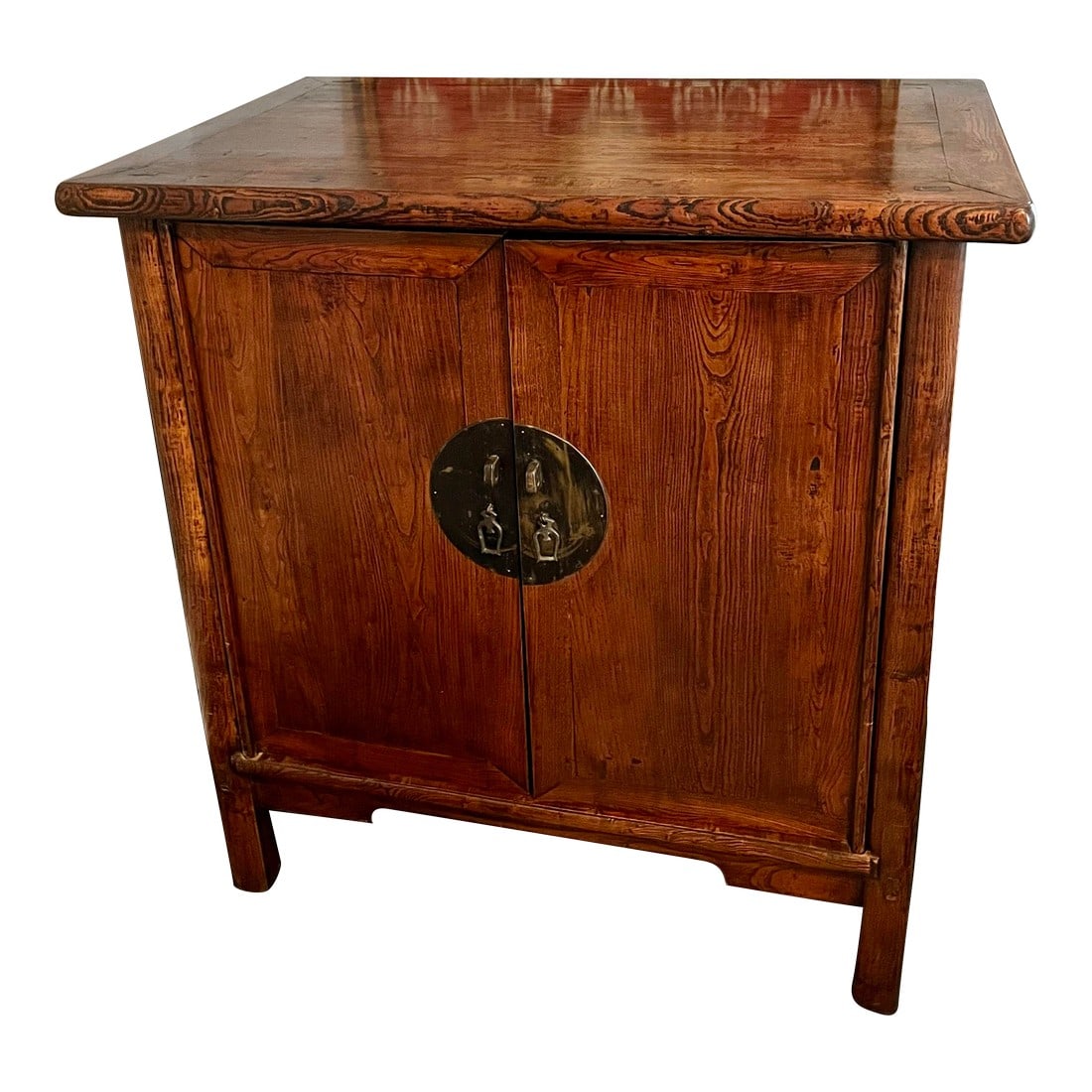 Late 19th Century Qing Elm "Wedding Cabinet": Steeped in quiet elegance, this late Qing Dynasty wedding cabinet was crafted in northern China from solid elmwood, valued for its luminous grain and warm, honeyed tone. The cabinet retains its