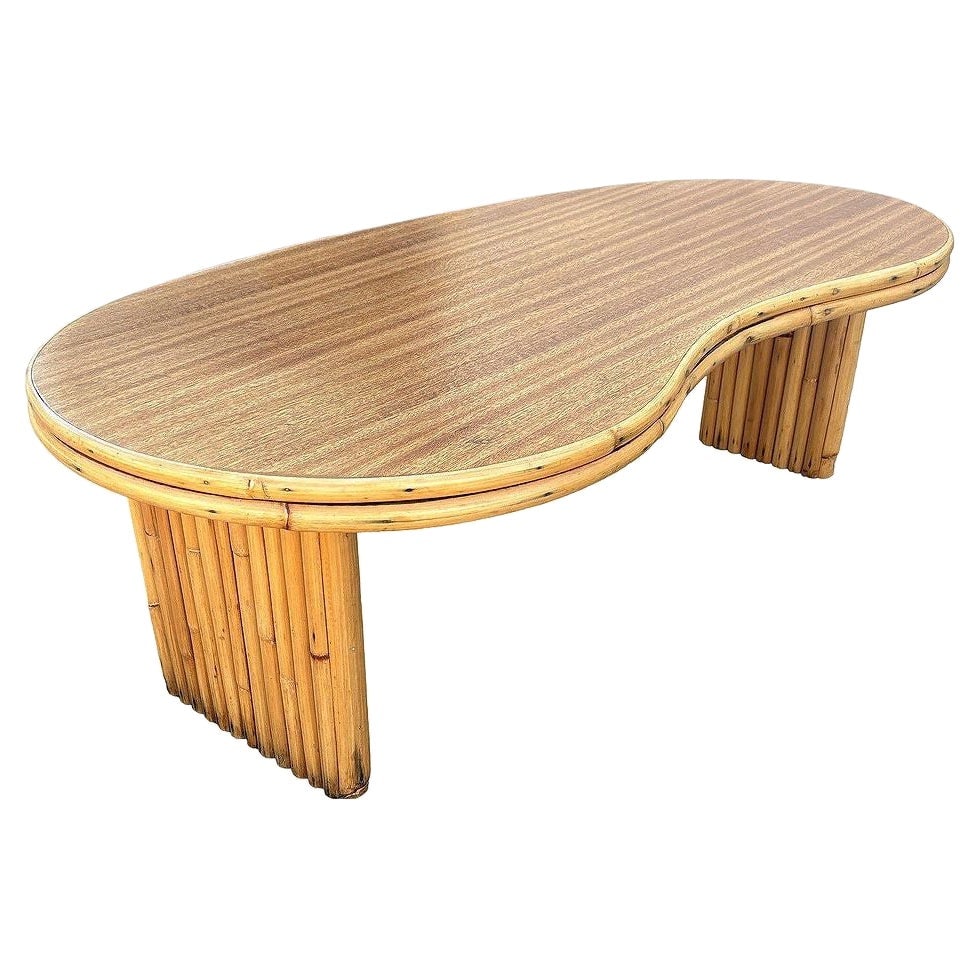 Restored Mid-century Stacked Rattan Biomorphic Coffee Table w/ Formica Top: Title: Restored Mid-century Stacked Rattan Biomorphic Coffee Table w/ Formica Top Description: This beautifully restored rattan and Formica coffee table boasts a bold amoeba-shaped top, embodying play