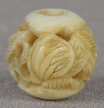 19c ojime netsuke slide BUTTERFLY & PEONY: 19th century small ojime (slide bead for tightening the cord going from netsuke to inro) carved in the round with a pierced design of a butterly by a blooming peony. Wonderful carving, excellent