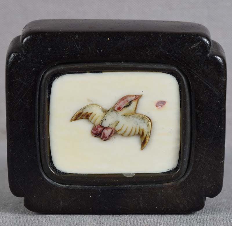 19c netsuke Shibayama BIRD in flight: 19th century netsuke of kagamibuta (mirror lid”) type with Shibayama inlay depicting a small bird (probably a sparrow) in flight chasing a single cherry blossom petal. Very well made, the inlay