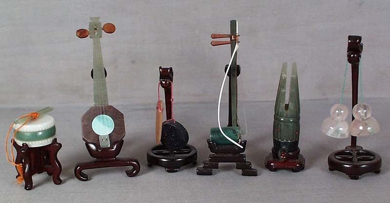 6 vintage Chinese hardstone & JADE MUSICAL INSTRUMENTS: Vintage set of 6 Chinese jade and hardstone musical instruments, each on a matching rosewood stand. Instruments include a drum with a pair of drumsticks, gong with striker, cymbals, reed flute and 2