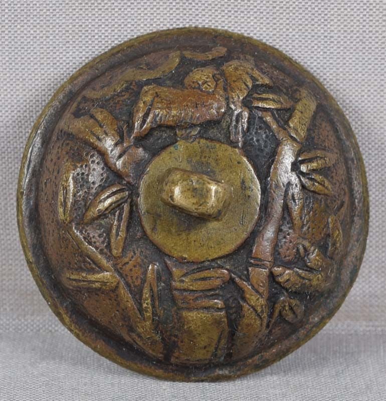 18c bronze suigaraake netsuke BIRDS & BAMBOO: Late 18th to early 19th century bronze suigaraake (ashtray) netsuke in classic bowl shape with cast decoration on the outside of 2 birds by bamboo stalks with leaves. Very well designed piece, good de