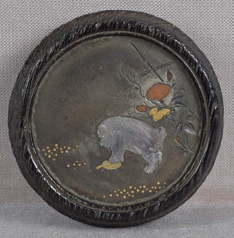 19c kagamibuta netsuke PUPPY & TURTLE: 19th century wood and metal kagamibuta (mirror lid) netsuke with patinated bronze top inlaid with gold, silver and bronze and depicting a puppy cautiously touching a turtle with its paw by a bamboo