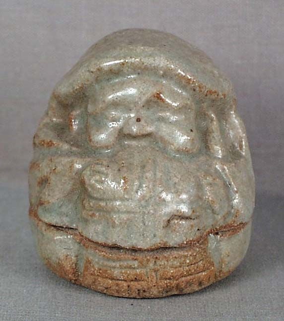 19c tea ceremony ceramic KOGO DAIKOKU with rice bale: Late 19th century Japanese stoneware kogo (box for holding incense during tea ceremony) in a form of Daikoku holding a rice bale in front of him. Daikoku is one of the 7 Gods of Good Fortune, that of