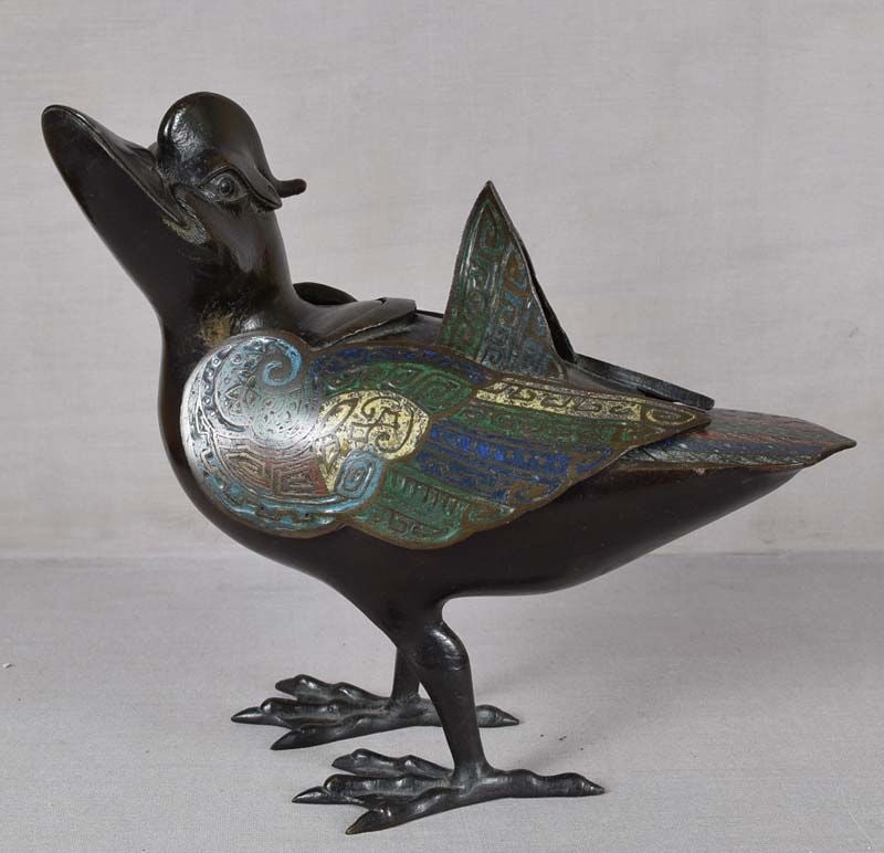 19c Chinese bronze champleve DUCK INCENSE BURNER: 19th century Chinese bronze incense burner in a shape of a standing mandarin duck with its head raised. Wings and tail are decorated in champleve technique with red, green, blue, turquoise and yellow