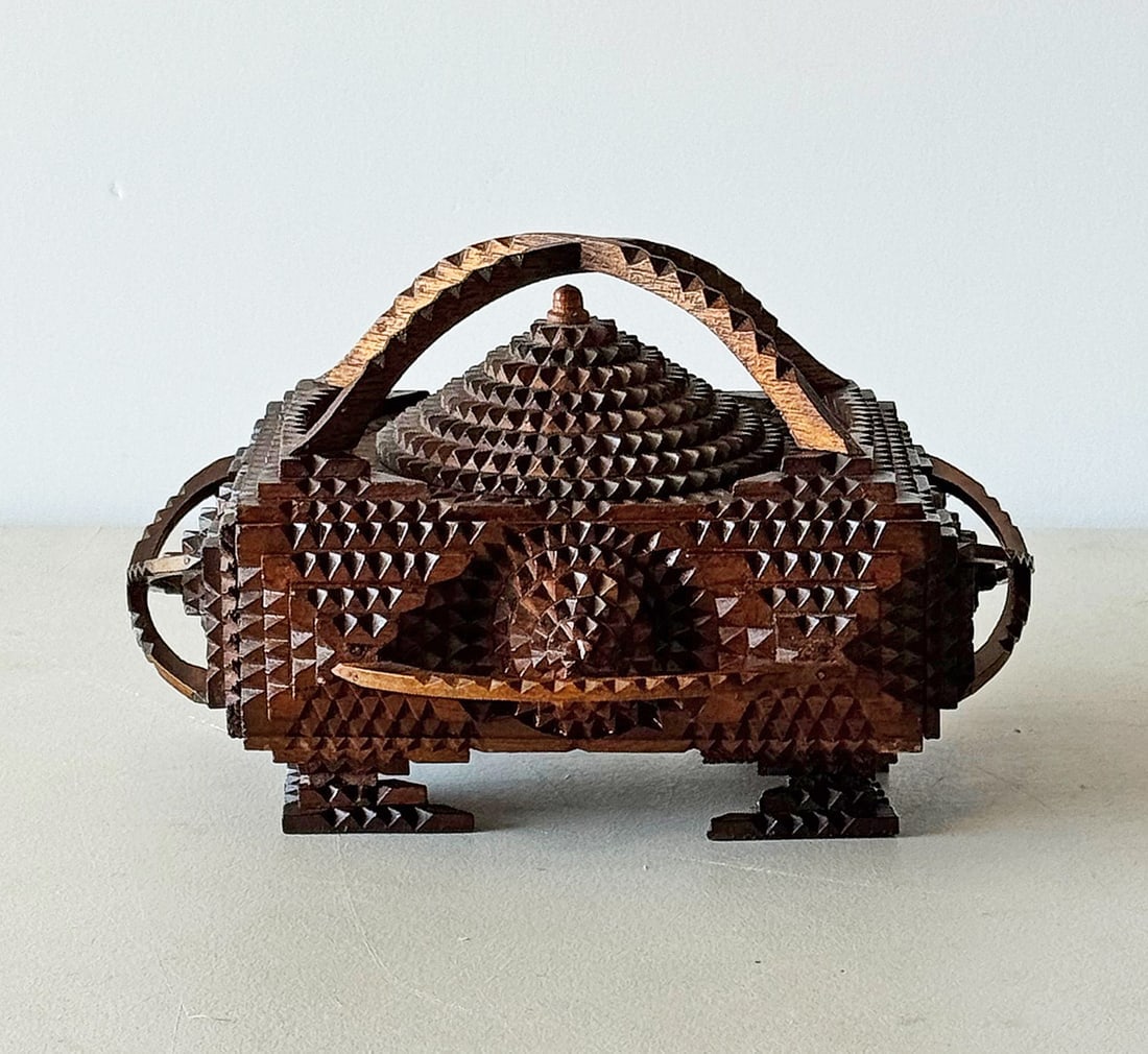 Important Tramp Art Box by Herman Metz: Herman Fredrick Metz was a fireman in St Joseph, MO who died tragically when he was thrown from the firewagon he was driving to a fire in 1918. Metz made a dozen futuristic looking tramp art pieces. A