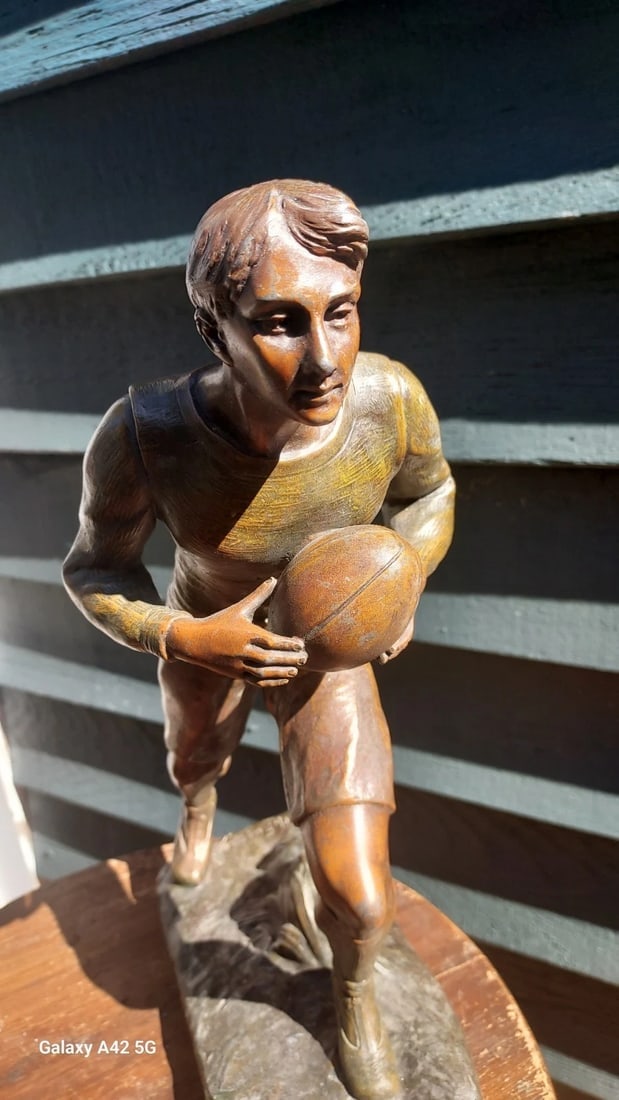 Rare Rugby Trophy Figure H. Fugere 13" tall spelter 1920: Great looking piece in excellent condition. Dates to 1930 and excellent details. Handsome face. Measures 13" tall. Shipping includes insurance. Shipping:Domestic: Flat-rate of $30.00 to anywhere