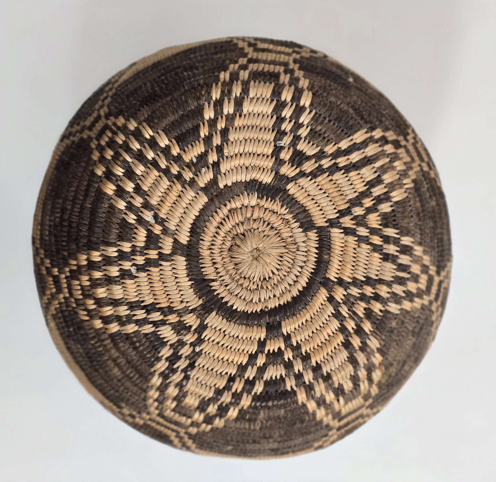 Yavapai woven miniature basketry olla ca 1900: Title: Yavapai woven miniature basketry olla ca 1900 Dimension: 8" tall x 7" diameter Description: A very fine small basketry olla Yavapai woven with typical strong positive/negative delineation in th