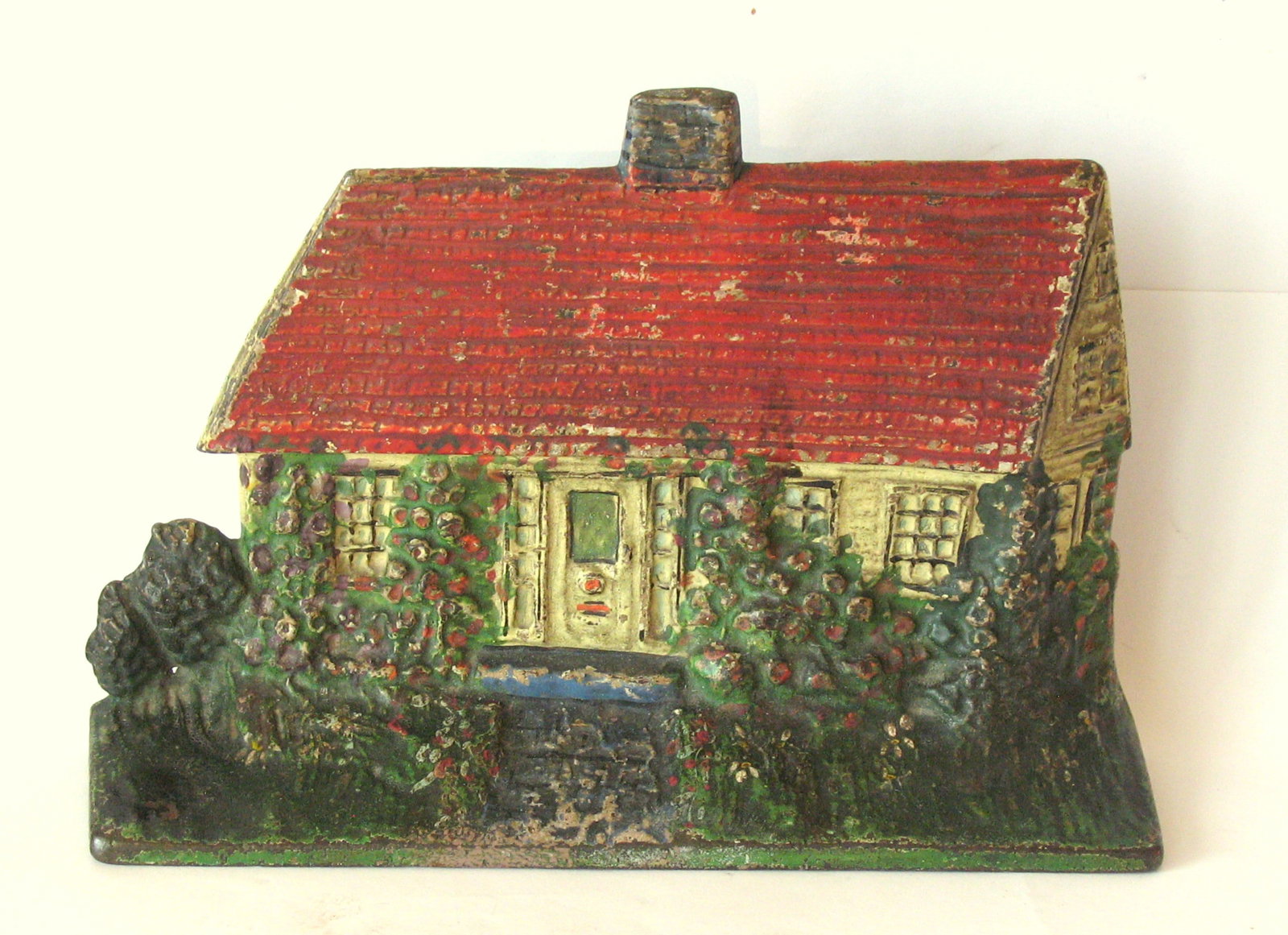 Antique cast iron cottage doorstop made by the Albany Foundry. (1 of 4)