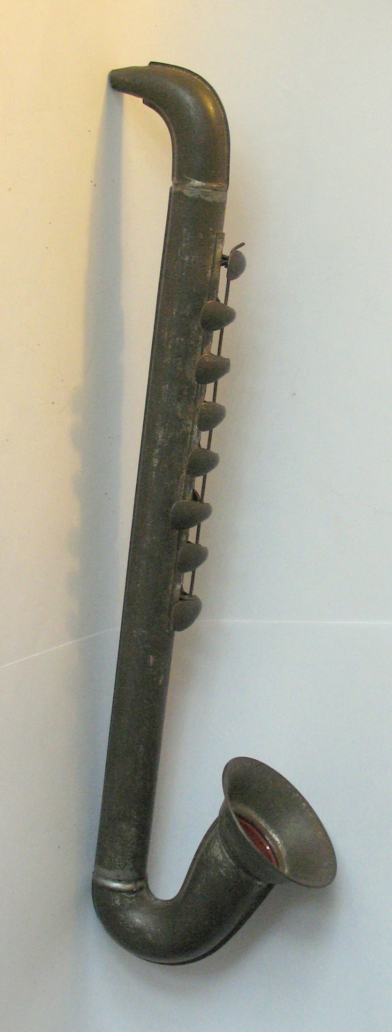 Antique tin toy Saxophone. (1 of 3)
