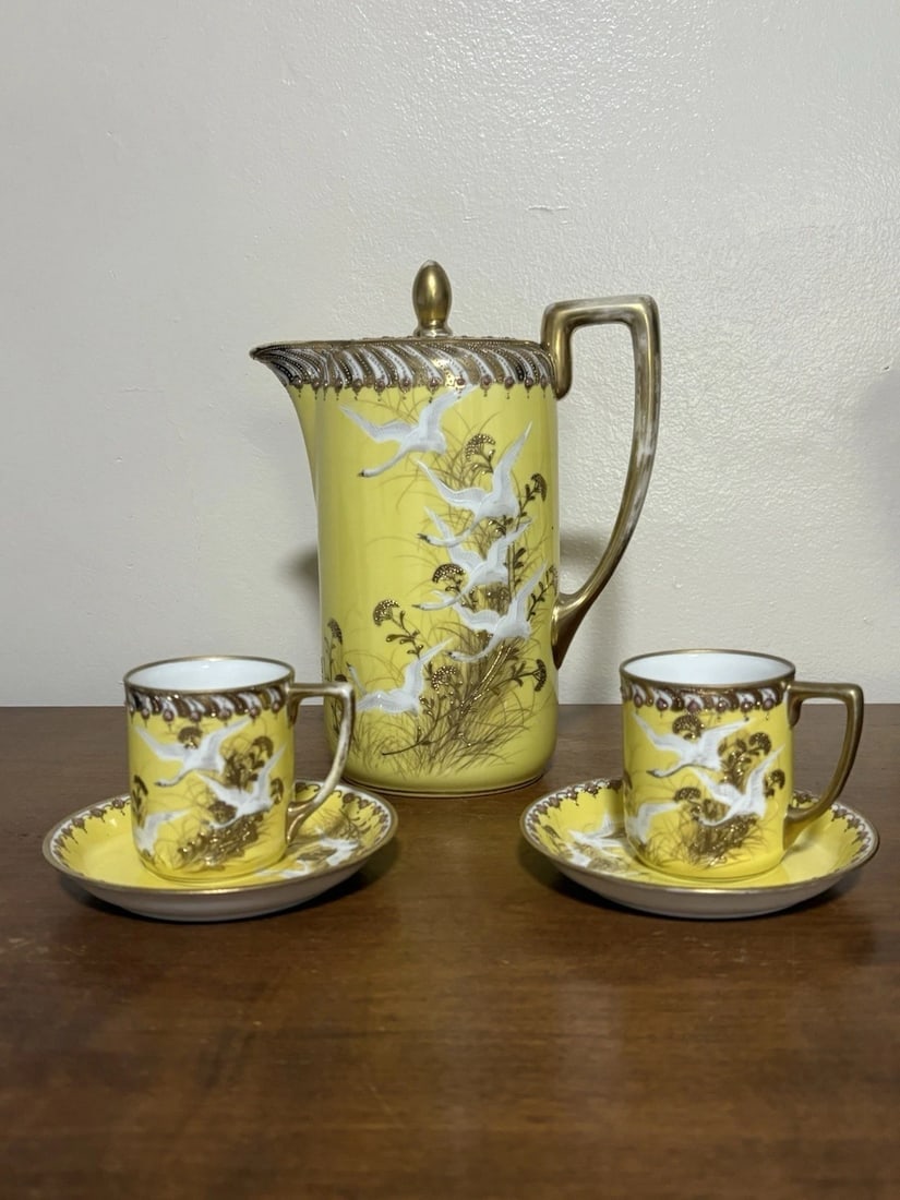 Rare Yellow 5pc Nippon Chocolate Set: The chocolate pot is 9” high and is marked, the cup measures 2 5/8” high x 3 1/4” and is marked and the saucer measures 4 7/8”. The set has no chips, cracks or repairs. It is