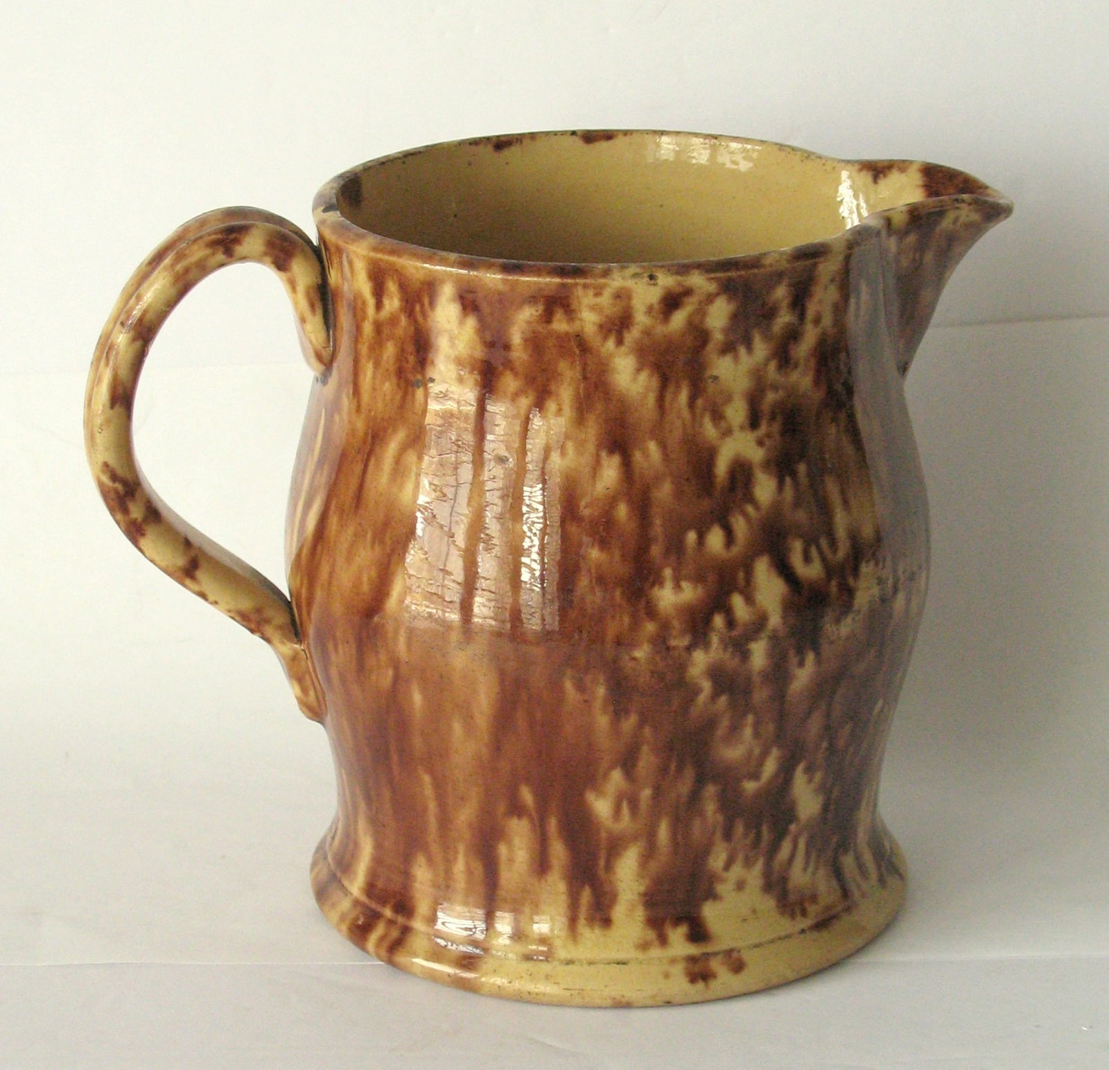 Antique yellow ware cream pitcher. - 2