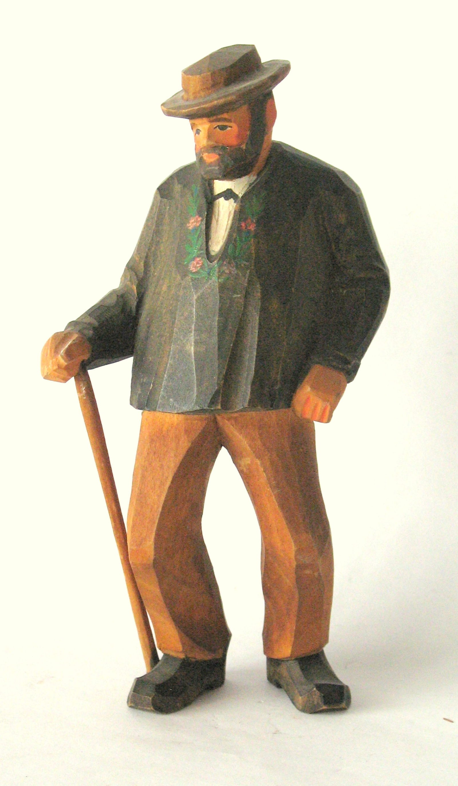 Antique folk art wood carving of a man.: Title: Antique folk art wood carving of a man.Date/Period: 1930'sDimension: 5 3/4” highAdditional Information: Nice antique folk art wood carving of a man in original paint, patina & condition.