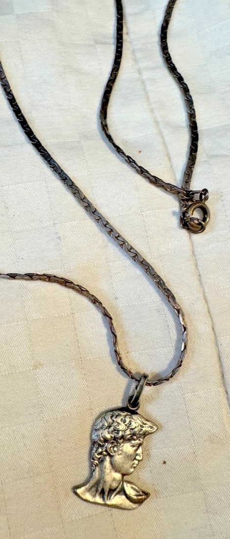 800 silver Pendant Necklace, Michelangelo David Pendant, Head of David Charm: This 800 silver Pendant Necklace features a unique Michelangelo David Pendant design, showcasing an oval-shaped head of David charm. The necklace is adjustable and nickel-free, making it suitable for