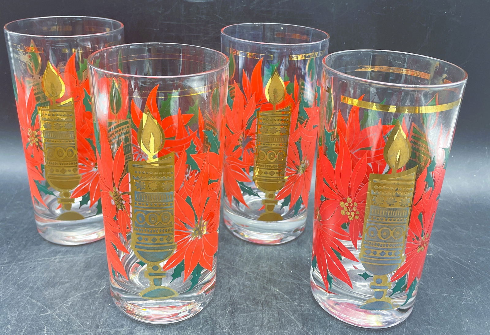 MCM Pasinski Christmas Glasses - 22K Gold Candles with Red Poinsettias: Date/Period: APPROX. 1950'SDimension: Approx 5.5 x 2.5Material: GLASSAdditional Information: MCM Pasinski Christmas Glasses - 22K Gold Candles with Red Poinsettias Shipping:Domestic: Flat-rate of