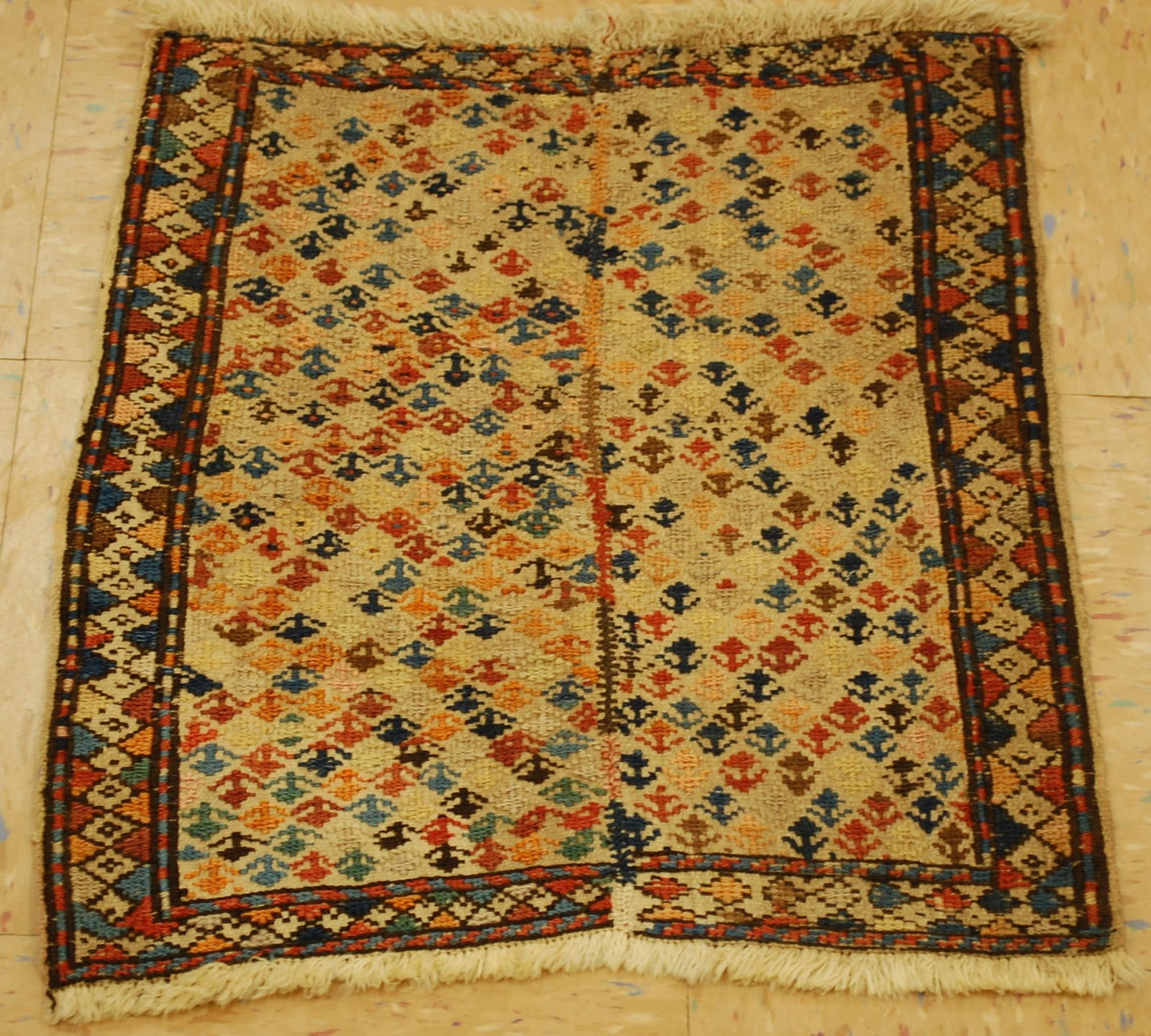 Shahsevan Khorjin Face, 1'6" X 1'9": Title:Shahsevan Khorjin Face, 1'6" X 1'9"Description:Shahsevan Khorjin Face, Transcaucasus, Early/Mid 19th C., sumak weave. Size: 1'6'' x 1'9'' colors including Red,Ivory,Beige,Tan,Gold,Greens