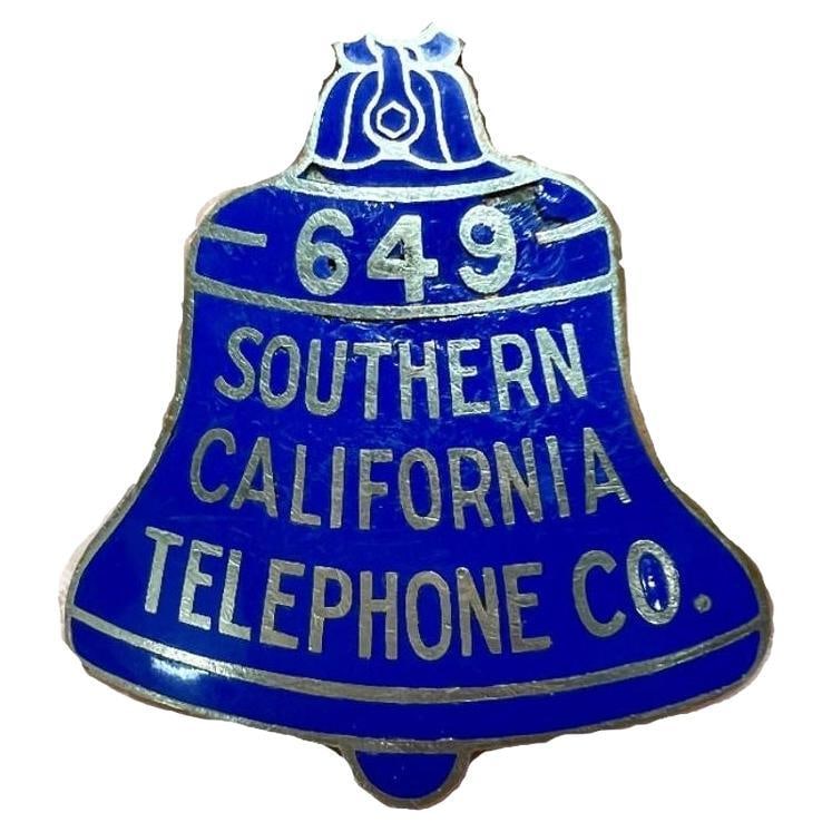 Vintage Southern California Telephone Company Badge: Title: Vintage Southern California Telephone Company Badge Description: Vintage enamel Bell shaped Southern CA Telephone Co badge with employee number 649 labeled along the top. Hallmarked Stamped
