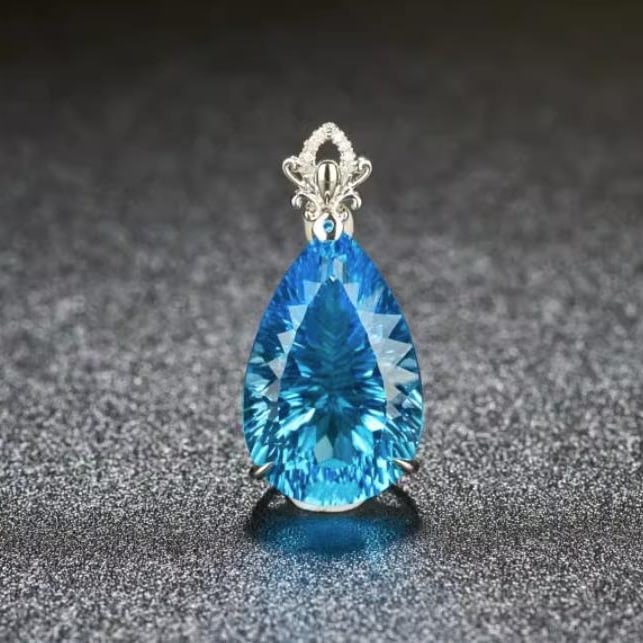 14K GOLD 21.6 CT NATURAL TOPAZ & DIAMOND PENDANT: Title:14K GOLD 21.6 CT NATURAL TOPAZ & DIAMOND PENDANTDescription:Ref:230528377Gold Content:14K GoldMain Gemstone:TopazNumber of stones:1Shape:PearCarat Weight:21.6ct Color:BlueTreatment:NaturalCut