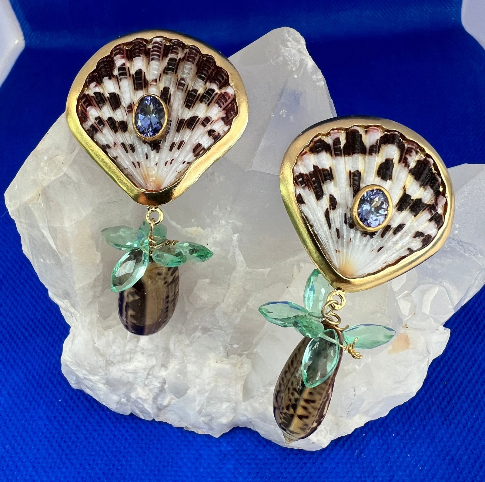 Scallop, Olive Shell and Tourmaline Drop Earrings: Title:Scallop, Olive Shell and Tourmaline Drop EarringsDescription:Darling patterned Scallops set with Tanzanite, Green Tourmaline elliptical briolettes and fancy small Olive Shells. - 1.5" drop -