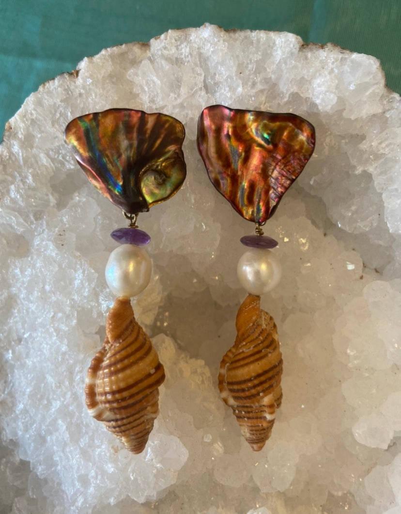 Cymbatium Shell Earrings: Title:Cymbatium Shell Earrings Description:These beautiful earrings are made up of Brown Cymbatium shells, Amethyst, Pearls, and brown Abalone. Perfect for a night out! Reserve: $156.00 Shipping: Dome