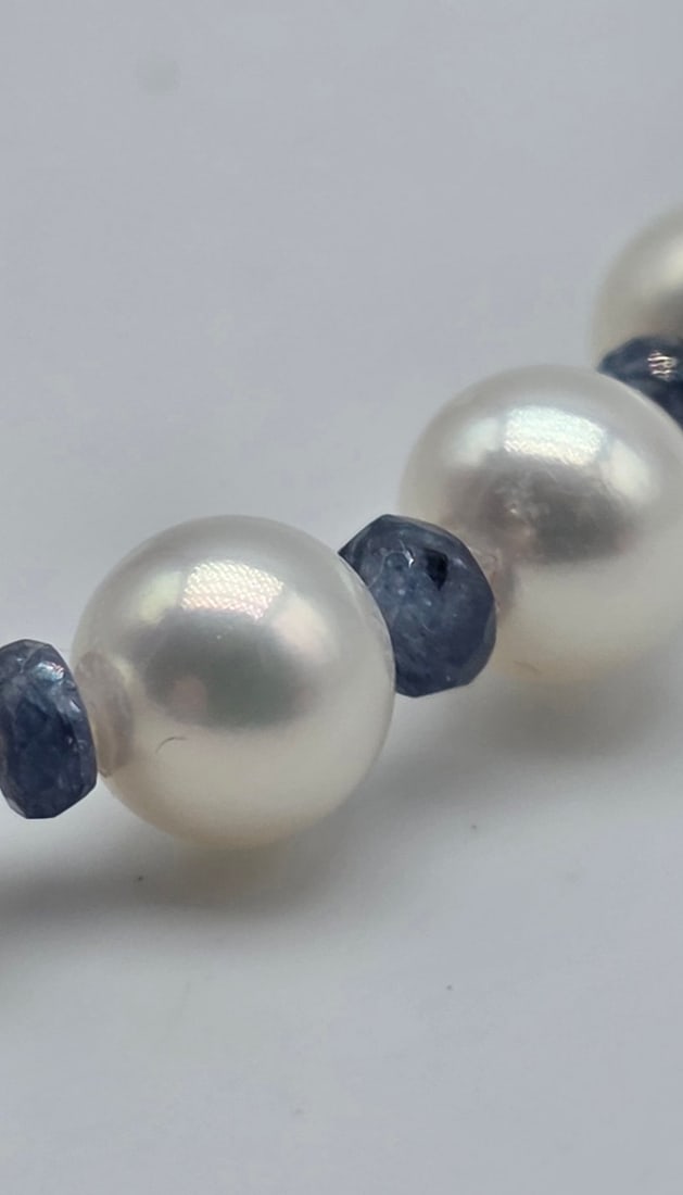 Akoya pearl necklace, 6.2 to 6.4 mm, with natural sapphire spacers, a central oval sapphire with - 5
