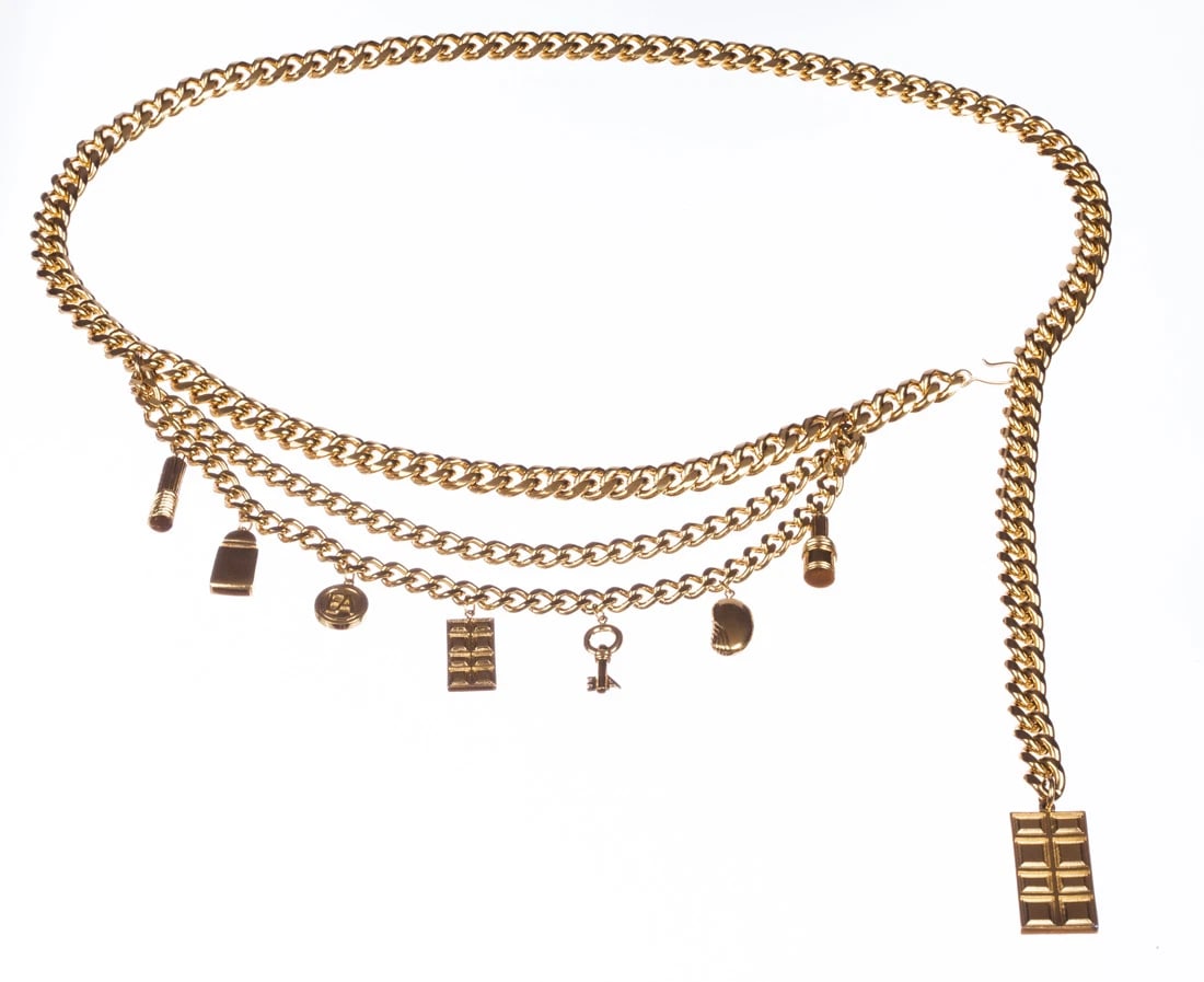 Emporio Armani Charm Necklace Belt: Title:Emporio Armani Charm Necklace Belt Description:Heavily plated in 18 kt gold over costume metal with assortment of charms. Circa, 1980’s. Necklace is 39” long and 3/8” wide. Charms